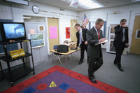 President George W. Bush takes notes as he listens to news coverage of the World Trade Center terrorist attacks Tuesday, Sept. 11, 2001, during a visit to Emma E. Booker Elementary School in Sarasota, Florida.