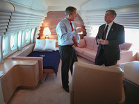 President George W. Bush confers with White House Chief of Staff Andy Card Tuesday, Sept. 11, 2001, in the President's stateroom aboard Air Force One. 