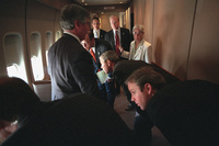 President George W. Bush and his staff look out the windows of Air Force One at their F-16 escort Tuesday, Sept. 11, 2001, while en route to Andrews Air Force Base. 