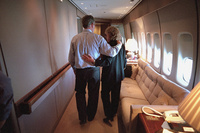 President George W. Bush comforts White House Staff Secretary Harriet Miers aboard Air Force One Tuesday, Sept. 11, 2001.