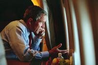 After departing Offutt Air Force Base in Nebraska, President George W. Bush confers with Vice President Dick Cheney from Air Force One during his flight to Andrews Air Force Base Sept. 11, 2001.