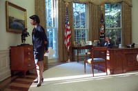 National Security Advisor Dr. Condoleezza Rice watches morning sunrise of Wednesday, Sept. 12, 2001, as President George W. Bush talks with British Prime Minister Tony Blair from the Oval Office. 