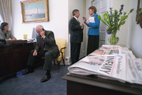 Vice President Dick Cheney talks on the telephone Wednesday, Sept. 12, 2001, while Andy Card talks with Karen Hughes in the Outer Oval Office of the White House.  