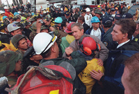 President George W. Bush greets firefighters and rescue workers at Ground Zero Friday, Sept. 14, 2001.