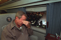 With smoke still billowing from the World Trade Center disaster site out the window, President George W. Bush departs New York City en route to Washington, D.C. aboard Marine One on Sept. 14, 2001.