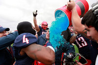 Arizona head football coach Rich Rodriguez is doused by his players after their 49-48 win over New Mexico in the New Mexico Bowl NCAA college football game in Albuquerque, N.M.