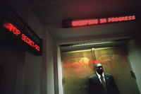 A Secret Service agent guards a secure location at Offutt Air Force Base Tuesday, Sept. 11, 2001, as President George W. Bush attends a national security meeting inside.  