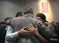 President George W. Bush consoles family members and greets FEMA and rescue personnel Friday, Sept. 14, 2001, after arriving at the Jacob J. Javitts Convention Center  in New York City. 