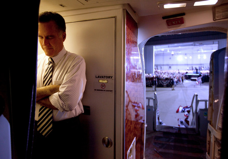 Mitt Romney pauses before greeting supporters at a rally in Cedar Rapids, IA. 