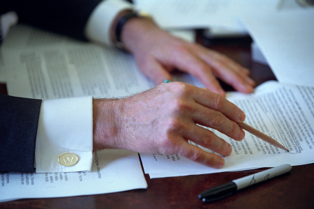 President George W. Bush works on his 2002 State of the Union speech in the Oval Office, Jan. 24, 2002.