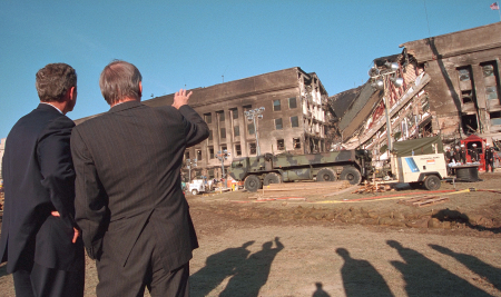 President George W. Bush and Secretary of Defense Don Rumsfeld survey the damage to the Pentagon, Sept. 12, 2001.